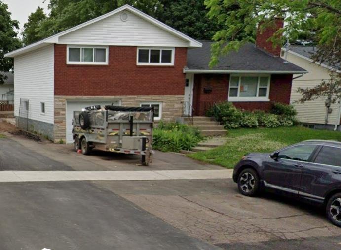 A single-storey brick home before a second-storey addition began