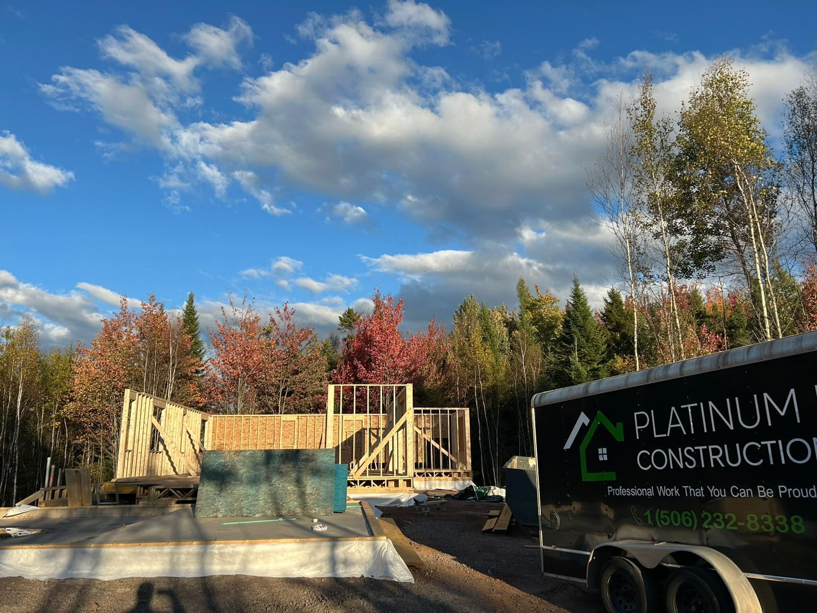 Platinum Pro Construction trailer on site as framing begins