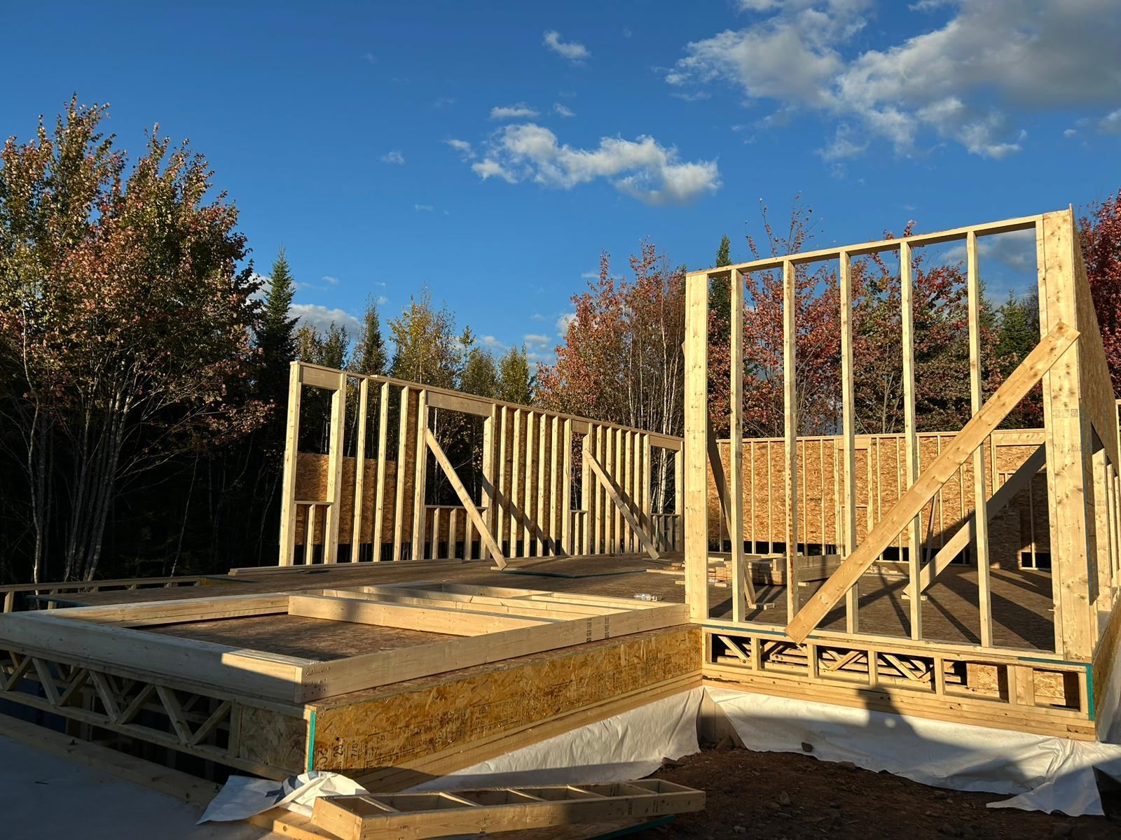 Exterior walls framed and standing on the new foundation
