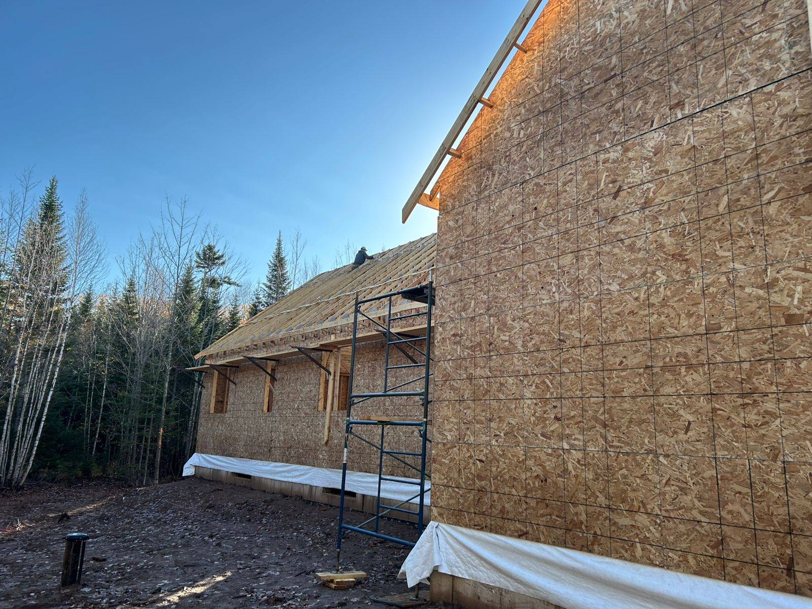 House fully sheathed and wrapped, ready for siding